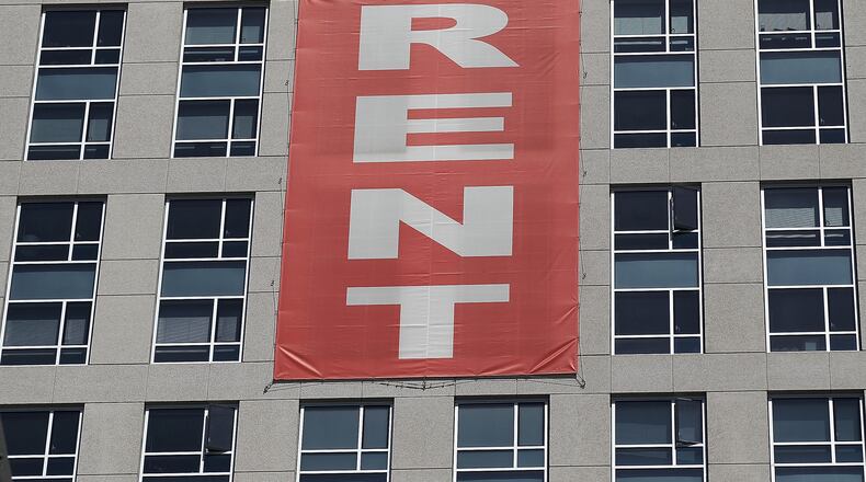 A large "rent" banner is posted on the side of an apartment building in San Francisco in 2012. (Justin Sullivan/Getty Images/TNS)