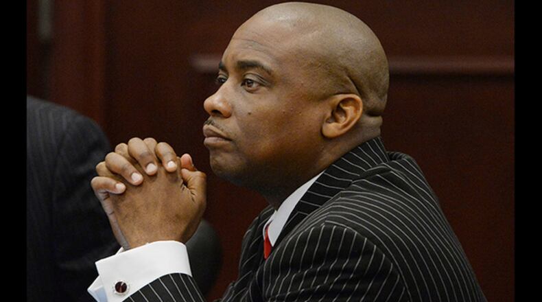 Clayton County Sheriff Victor Hill in court during his trial on 27 felony racketeering charges in 2013. JOHNNY CRAWFORD / JCRAWFORD@AJC.COM