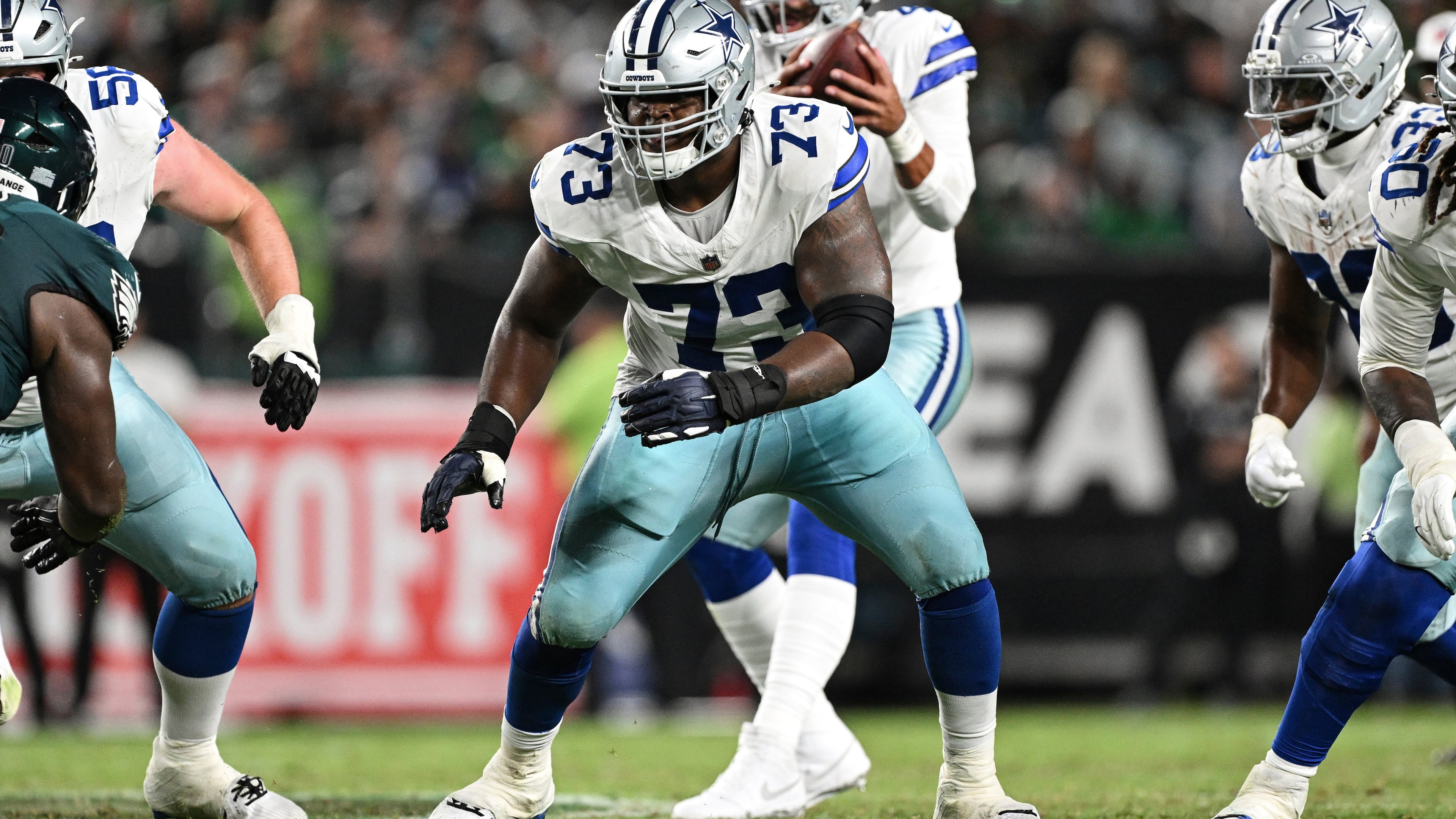 FILE - Dallas Cowboys guard Tyler Smith (73) prepares to block during the second half of an NFL football game against the Philadelphia Eagles, Thursday, Sept. 4, 2025, in Philadelphia. (AP Photo/Terrance Williams, File)