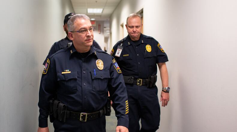 Chief of Police Joe Bennet walks the halls with Deputy Chief of Police Robert Harvey and Officer Ryan Hanson (behind Bennet) at the Smyrna Police Headquarters in Smyrna, Georgia, on Wednesday, February 26, 2020. As Smyrna’s new Chief of Police, Joe Bennett wants to work on hiring new officers and address the increase in the number of traffic-related crashes and fatalities in the city. Bennett was sworn into the new position in February. (Photo/Rebecca Wright for the AJC)