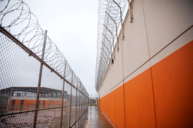 Barbed wire lines a recreation area at the Stewart Detention Center in Lumpkin, Ga. Judges have been denying bond to detained immigrants at high rates since Donald Trump reclaimed the White House. (David Goldman/AP 2019)