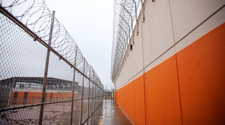 Barbed wire lines a recreation area at the Stewart Detention Center in Lumpkin, Ga. Judges have been denying bond to detained immigrants at high rates since Donald Trump reclaimed the White House. (David Goldman/AP 2019)