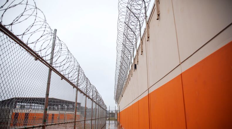 Barbed wire lines a recreation area at the Stewart Detention Center, Friday, Nov. 15, 2019, in Lumpkin, Ga. The Stewart Detention Center sits in Lumpkin, a rural town about 140 miles southwest of Atlanta and right next to the Georgia-Alabama state line. The city's 1,172 residents are outnumbered by the roughly 1,650 male detainees that U.S. Immigration and Customs Enforcement said were being held in the detention center in late November. (David Goldman/AP)