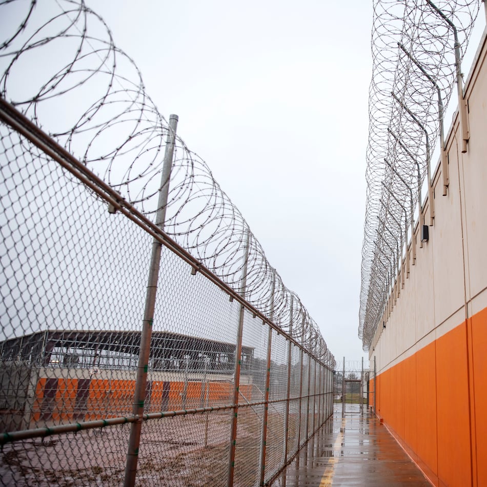 Barbed wire lines a recreation area at the Stewart Detention Center, Friday, Nov. 15, 2019, in Lumpkin, Ga. The Stewart Detention Center sits in Lumpkin, a rural town about 140 miles southwest of Atlanta and right next to the Georgia-Alabama state line. The city's 1,172 residents are outnumbered by the roughly 1,650 male detainees that U.S. Immigration and Customs Enforcement said were being held in the detention center in late November. (David Goldman/AP)