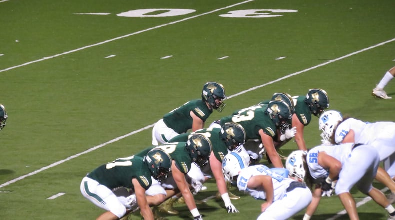 Blessed Trinity Titans quarterback Duncan Reavis awaits the snap in their game against the Denmark Danes on Friday, Oct. 11, 2019 in Roswell.