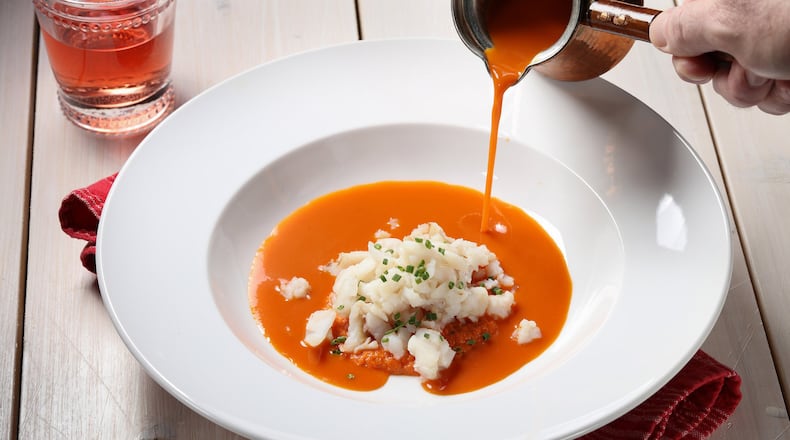 The nicoise-style soup has a base of sauteed vegetables and tomatoes. Those ingredients are pureed, then the soup is finished with cod. (Abel Uribe/Chicago Tribune/TNS)