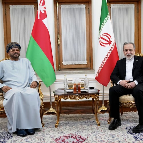 In this photo released by the Iranian Foreign Ministry, Foreign Minister Abbas Araghchi, right, meets his Omani counterpart Sayyid Badr Albusaidi in Tehran, Iran, Tuesday, Aug. 25, 2026. (Iran's Foreign Ministry, via AP)