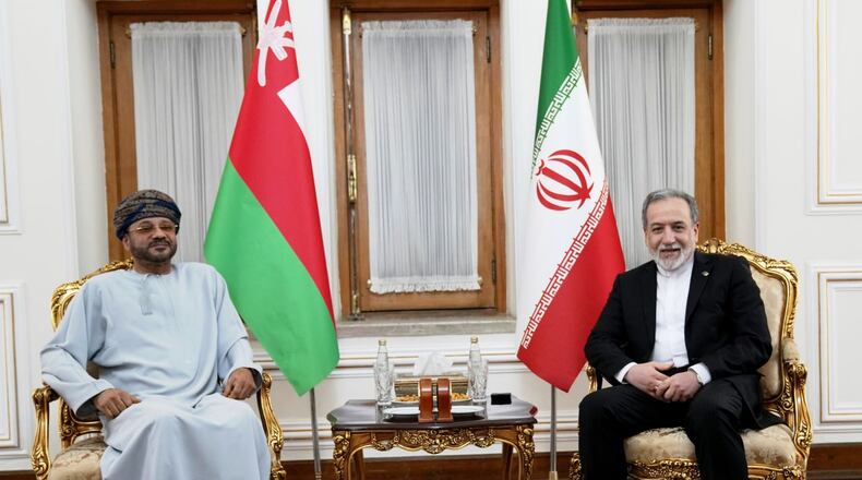 In this photo released by the Iranian Foreign Ministry, Foreign Minister Abbas Araghchi, right, meets his Omani counterpart Sayyid Badr Albusaidi in Tehran, Iran, Tuesday, Aug. 25, 2026. (Iran's Foreign Ministry, via AP)