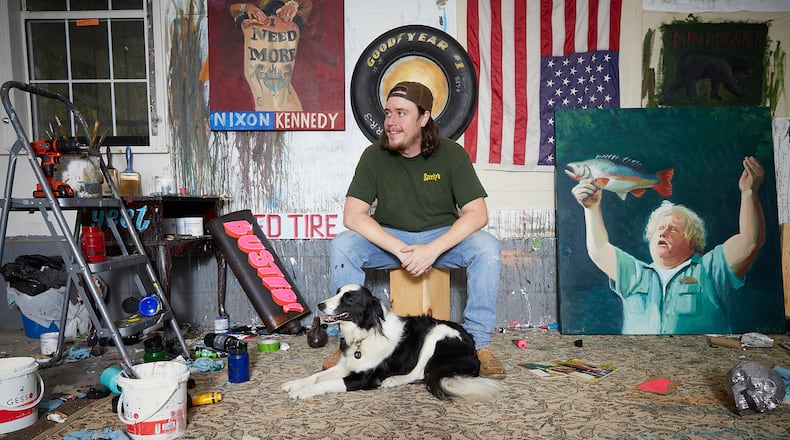 Painter Evan Jones sits with his dog Ace in his Austell studio.
(Courtesy of Maddy Michelle)