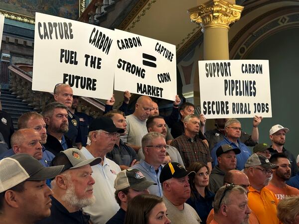 Iowans that rely on the state's ethanol industry rally at the statehouse in Des Moines on Friday, May 9, 2025 to voice support for a massive carbon-capture pipeline project routed across several Midwest states. (AP Photo/Hannah Fingerhut)