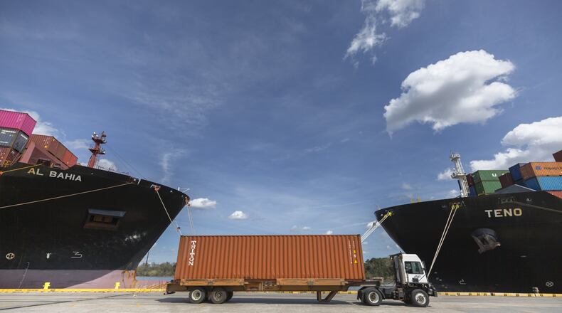 GARDEN CITY, GA - MARCH 13, 2020: A truck carrying a container drives away from the container ship Al Bahia at the Port of Savannah’s Garden City Terminal. (AJC Photo/Stephen B. Morton)