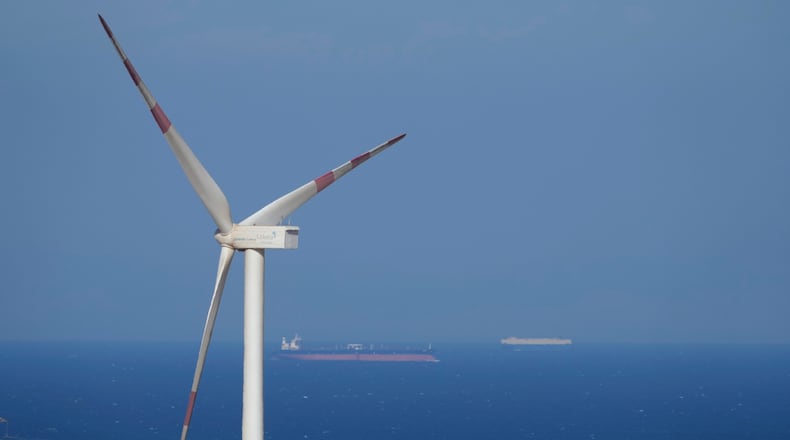 FILE - Cargo ships sail past Lekela wind power station near the Red Sea city of Ras Ghareb, Egypt, Oct. 12, 2022. (AP Photo/Amr Nabil, File)