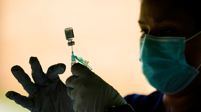 Georgia’s mounting COVID-19 case numbers Friday came as failures with the state’s public health data systems yet again prevented DPH from producing its daily report on pandemic information. (AP Photo/Matt Rourke, File)