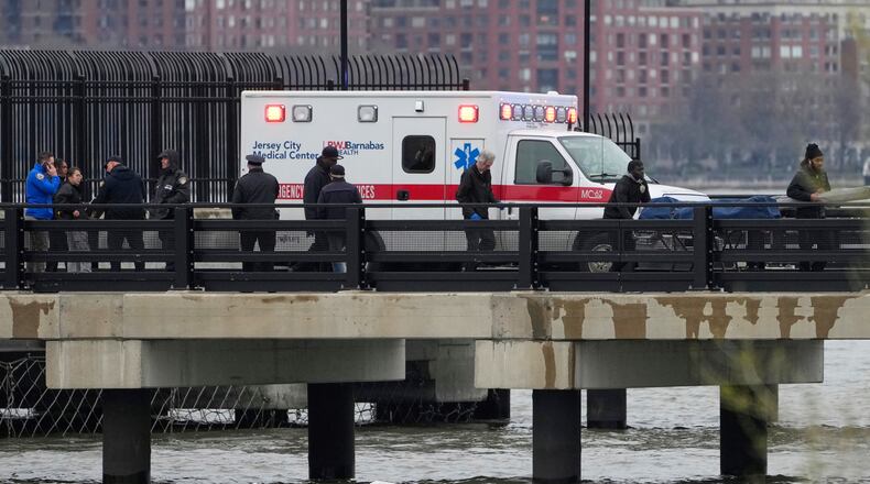 FILE - Emergency personnel respond to a helicopter crash on the Hudson River, April 10, 2025, in Jersey City, N.J. (AP Photo/Seth Wenig, File)