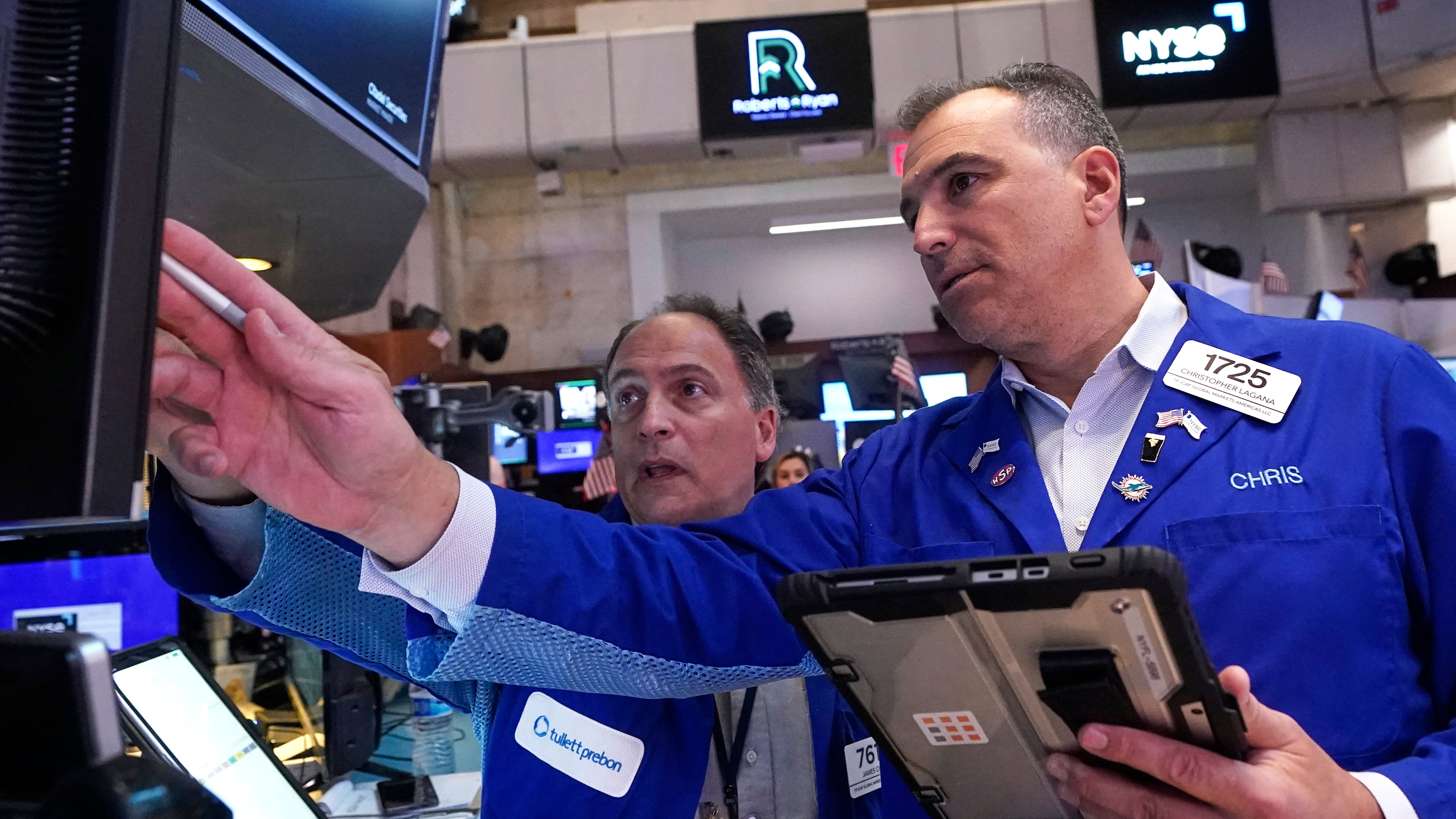 Traders James Conti, left and Christopher Lagana work on the floor of the New York Stock Exchange, Wednesday, Sept. 17, 2025. (AP Photo/Richard Drew)