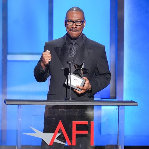 Eddie Murphy accepts the 51st AFI Life Achievement Award during a tribute to him on Saturday, April 18, 2026, at the Dolby Theatre in Los Angeles. (AP Photo/Chris Pizzello)