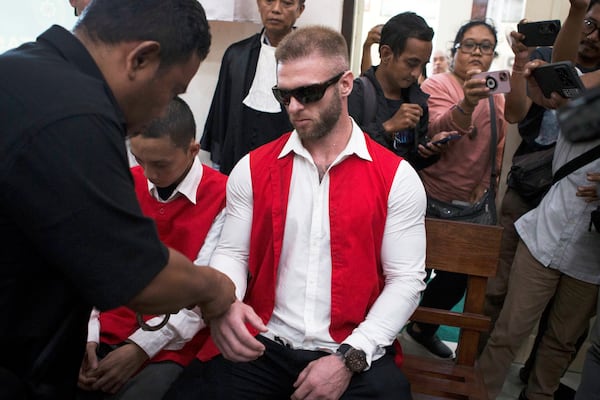 British citizen Thomas Parker who is accused of drug offenses sits on the defendant's chair before the start of his trial hearing at a district court in Denpasar, Bali, Indonesia, Tuesday, May 20, 2025. (AP Photo/Firdia Lisnawati)