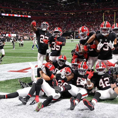The Atlanta Falcons celebrate after an interception during the second half against the Buffalo Bills on Monday. (Colin Hubbard/AP)