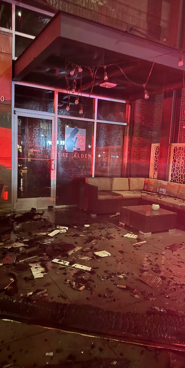 The Alden patio at night after it was damaged by a fire.