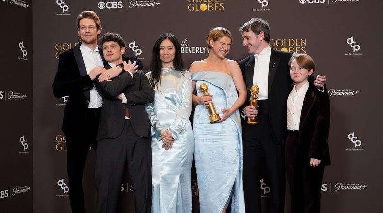 Joe Alwyn, from left, Noah Jupe, Chloe Zhao, Jessie Buckley, Paul Mescal, and Jacobi Jupe pose in the press room with the award for best motion picture - drama for "Hamnet" during the 83rd Golden Globes on Sunday, Jan. 11, 2026, at the Beverly Hilton in Beverly Hills, Calif. (AP Photo/Chris Pizzello)