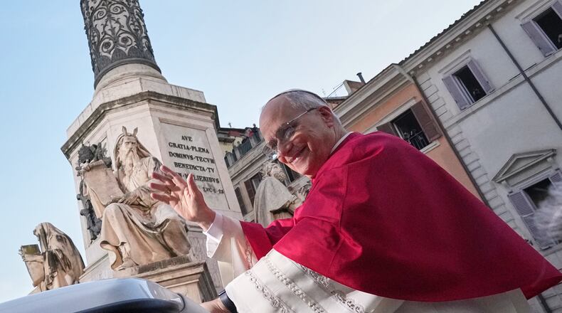 Pope Leo XIV leaves after praying in front of the statue of the Virgin Mary next to the Spanish Steps in Rome, Monday, Dec. 8, 2025, on the Catholic Feast of the Immaculate Conception. (AP Photo/Andrew Medichini)