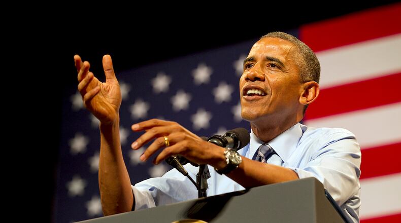 President Barack Obama gives a speech at the Paramount Theatre in downtown Austin touting his administration's accomplishments and the lack of support from the Republicans in Congress during a fundraising stop Thursday afternoon July 10, 2014.
RALPH BARRERA / AMERICAN-STATESMAN
