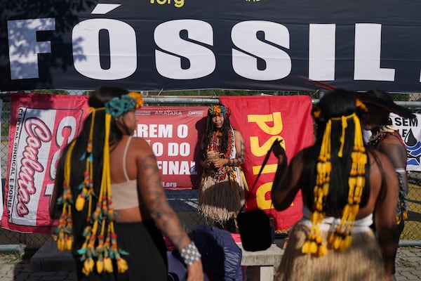 Indigenous women attend a protest against the auction of dozens of oil blocks, including blocks near the mouth of the Amazon River, in Rio de Janeiro, Tuesday, June 17, 2025. (AP Photo/Silvia Izquierdo
