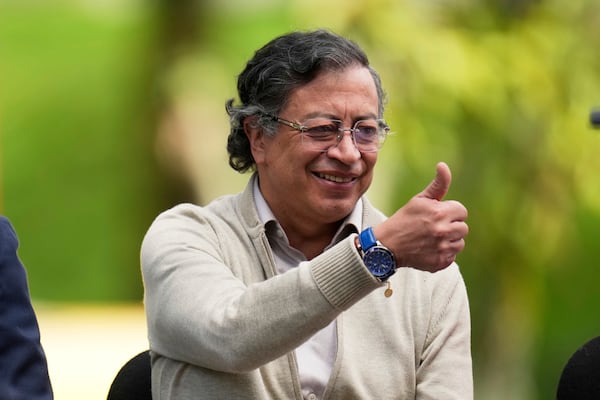 Colombia's President Gustavo Petro gives a thumbs up before signing a labor reform bill into law, in Bogota, Colombia, Wednesday, June 25, 2025. (AP Photo/Fernando Vergara)