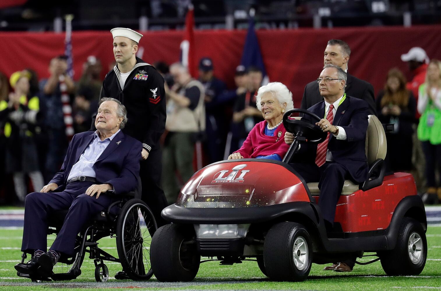 President George H.W. Bush flips coin at Super Bowl