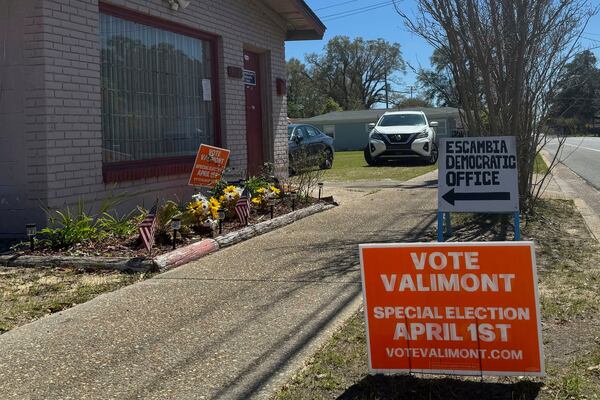 FILE - A sign for Democrat Gay Valimont is displayed outside the Escambia County Democratic Party office in Pensacola, Fla. on March 18, 2025. (AP Photo/Kate Payne, file)