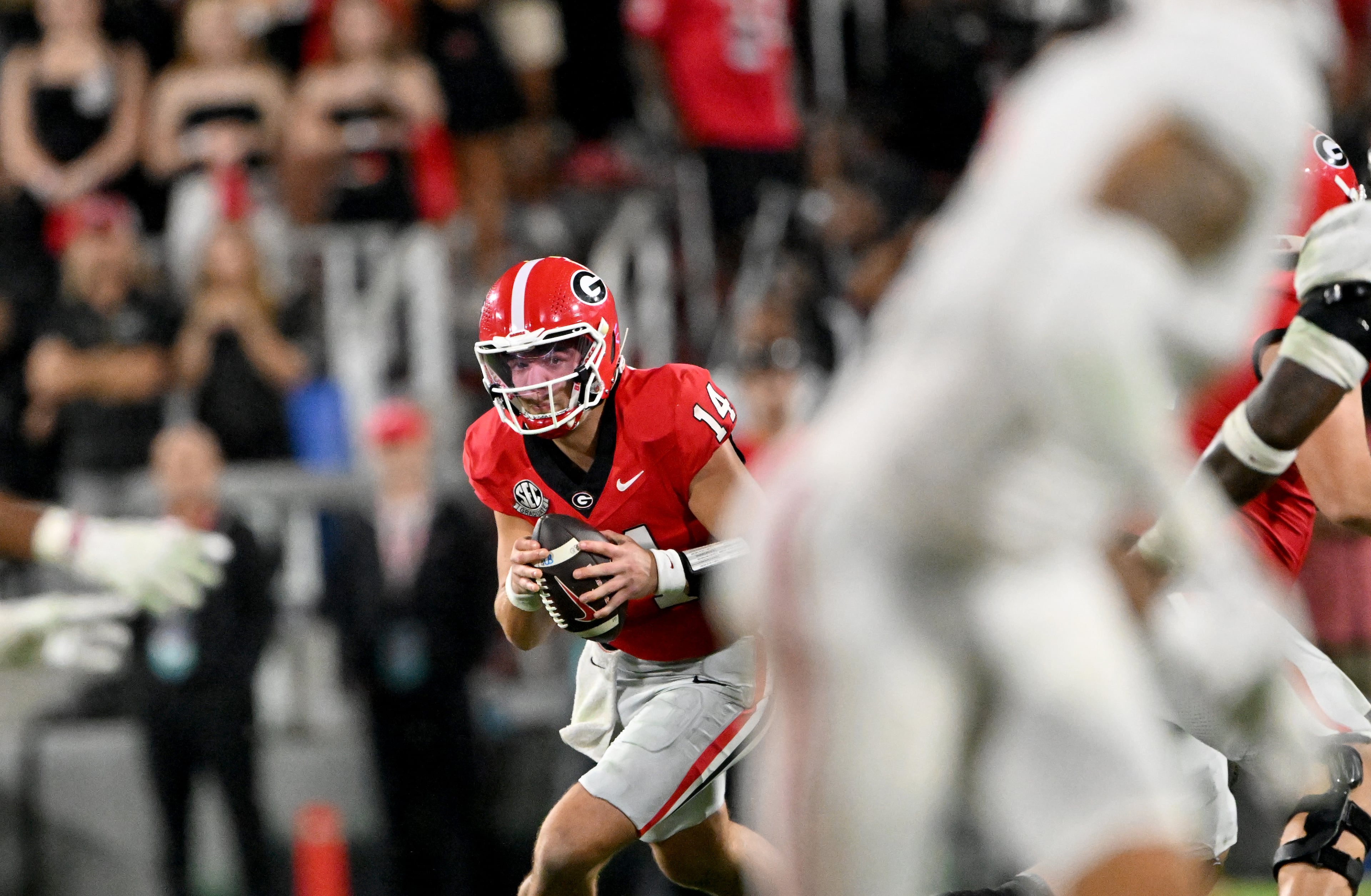 Georgia quarterback Gunner Stockton (14) runs the ball during the second half in an NCAA football game at Sanford Stadium, Saturday, September 27, 2025, in Athens. Alabama won 24-21 over Georgia. (Hyosub Shin / AJC)