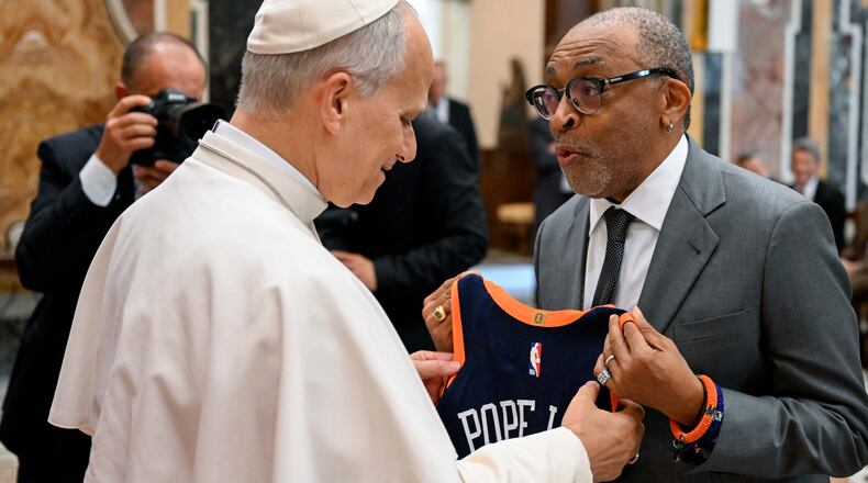 Pope Leo XIV meets with Spike Lee during an audience with and stars directors from the cinema at the Vatican, Saturday, Nov. 15, 2025. (Vatican Media Via AP)