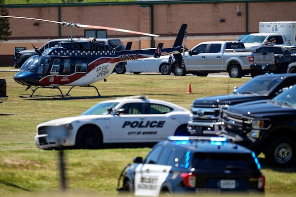 FILE - A medical helicopter is seen in front of Apalachee High School after a shooting at the school Wednesday, Sept. 4, 2024, in Winder, Ga. (AP Photo/Mike Stewart, File)