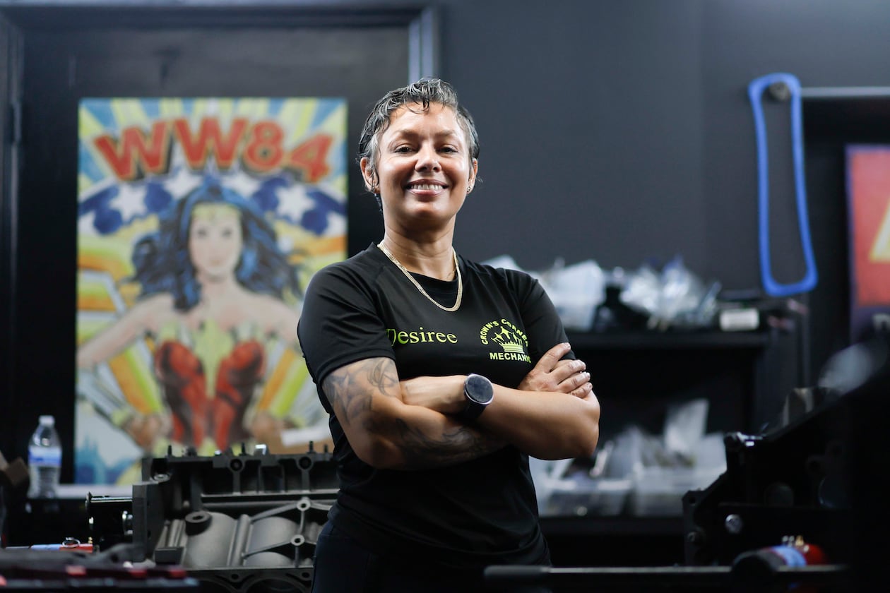 Desiree White, owner of Crown’s Corner Mechanics, stands in the engine room where she has five machines working simultaneously on Thursday, June 4, 2026. The shop offers general mechanic services, but specializes in building vintage car engines. (Miguel Martinez/AJC)