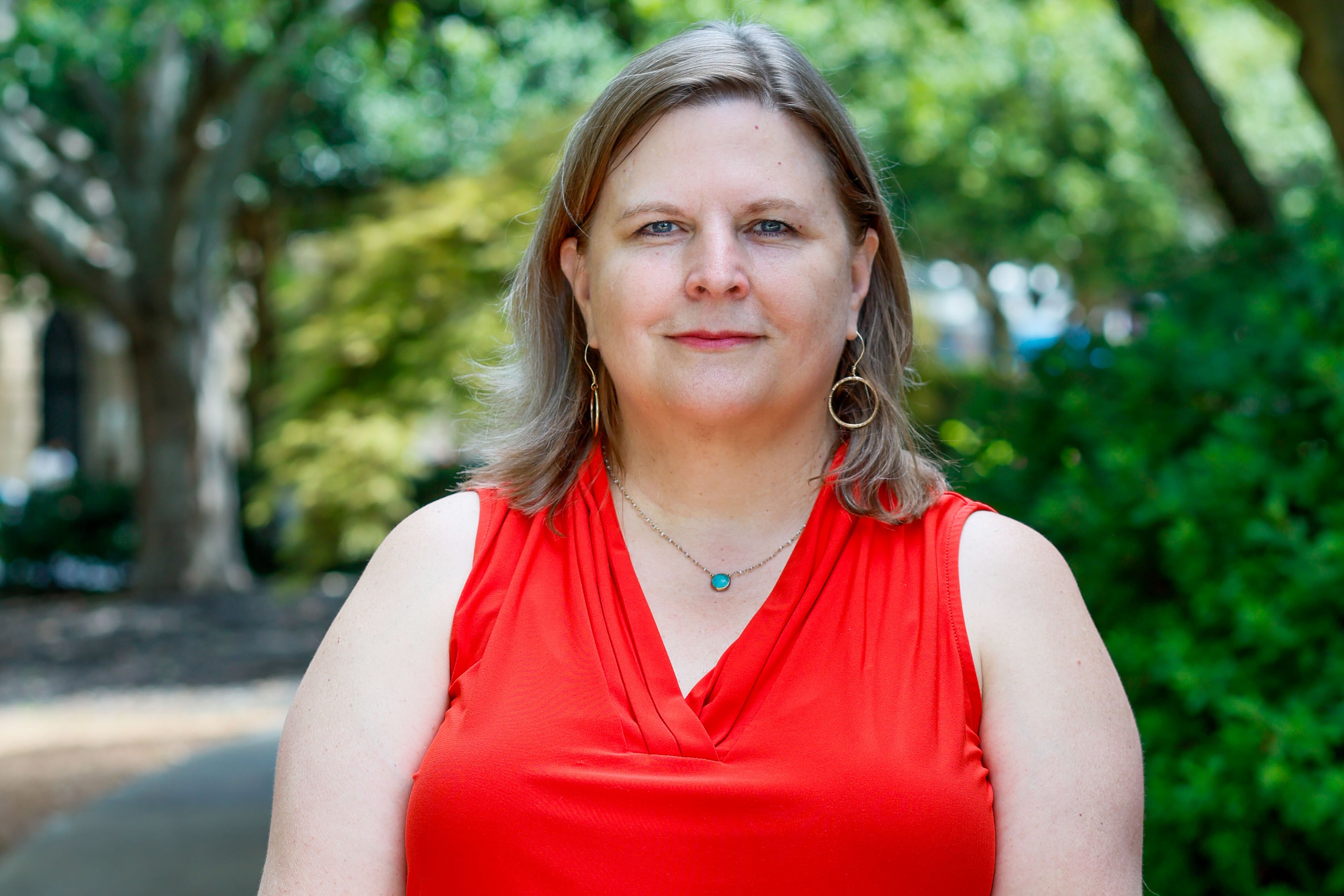 AJC health care reporter Ariel Hart poses for a photograph in Downtown Decatur on Tuesday, August 13, 2024. (Miguel Martinez/AJC)