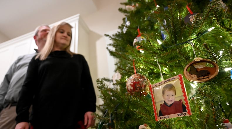 A Christmas ornament showcases a picture of Grant Martin when he was 5 years old. Grant, 24, died in July after a long hospitalization and eventual heart transplant. Hyosub Shin/AJC