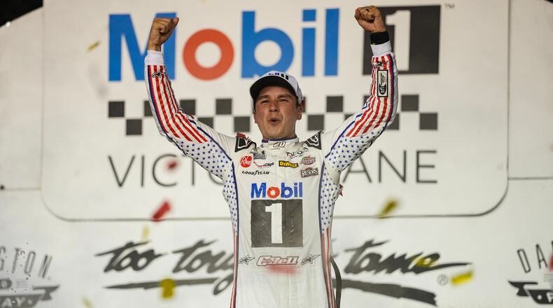 Christopher Bell celebrates in Victory Lane after winning a NASCAR Cup Series auto race Sunday, Sept. 6, 2026, in Darlington, S.C. (AP Photo/Matt Kelley)