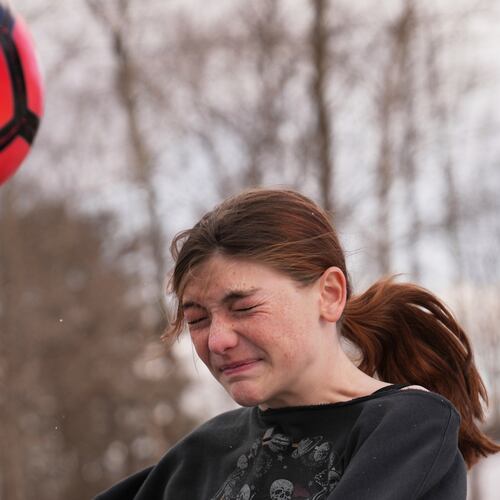 FILE - Parker Tirrell, a transgender athlete who plays on her high school's girls soccer team, heads the ball, Friday, March 7, 2025, in Plymouth, N.H. (AP Photo/Charles Krupa, File)