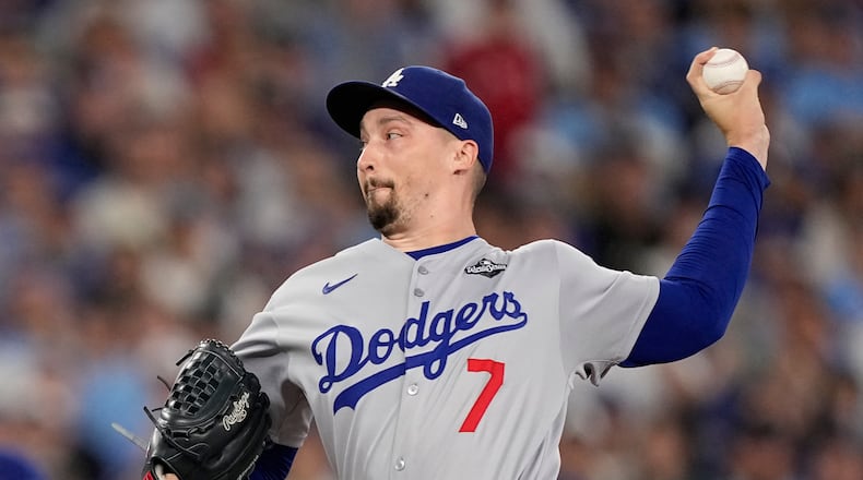 FILE - Los Angeles Dodgers pitcher Blake Snell throws against the Toronto Blue Jays during the eighth inning in Game 7 of baseball's World Series, on Nov. 1, 2025, in Toronto. (AP Photo/Brynn Anderson, File)