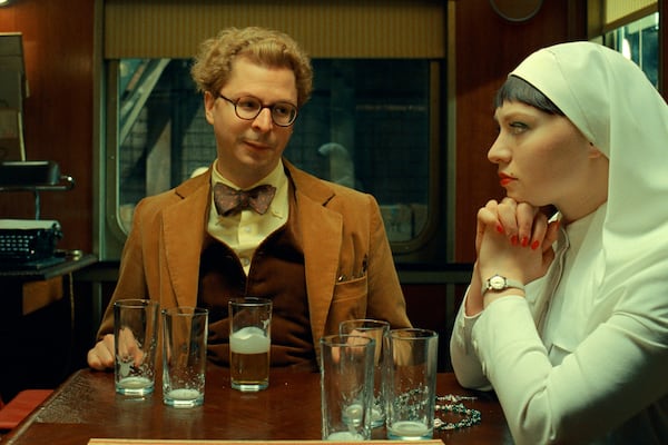 This image released by Focus Features shows Michael Cera, left, and Mia Threapleton in a scene from "The Phoenician Scheme." (TPS Productions/Focus Features via AP)