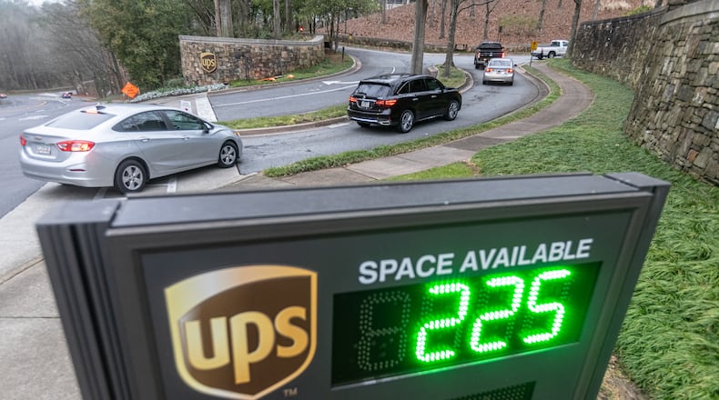 Cars arrive at 55 Glenlake Parkway NE, in Sandy Springs where office workers at UPS streamed back into work on Monday, March, 4, 2024 the first day a new policy requiring them to come into work in person five days a week took effect. The new policy was announced in January, (John Spink / John.Spink@ajc.com)
