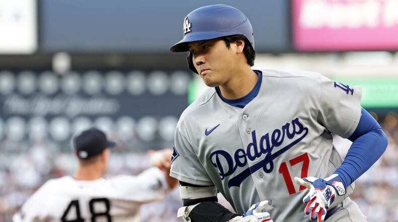 Los Angeles Dodgers designated hitter Shohei Ohtani (17) reacts after grounding out during the first inning of a baseball game against the New York Yankees, Friday, July 17, 2026, in New York. (AP Photo/Adam Hunger)