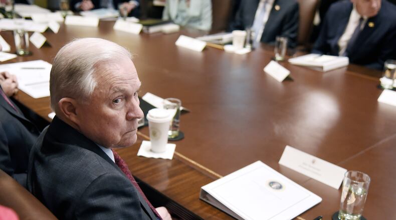 Attorney General Jeff Sessions looks on during a cabinet meeting with President Donald Trump on Wednesday in Washington. Olivier Douliery-Pool/Getty Images