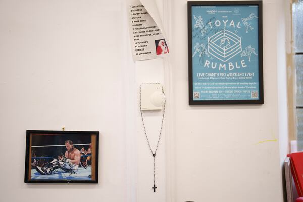 Wrestling themed memorabilia is seen backstage at St Peter's Church in Shipley before one of Kingdom Wrestling's monthly wrestling shows, Saturday, March 29, 2025. (AP Photo/Jon Super)