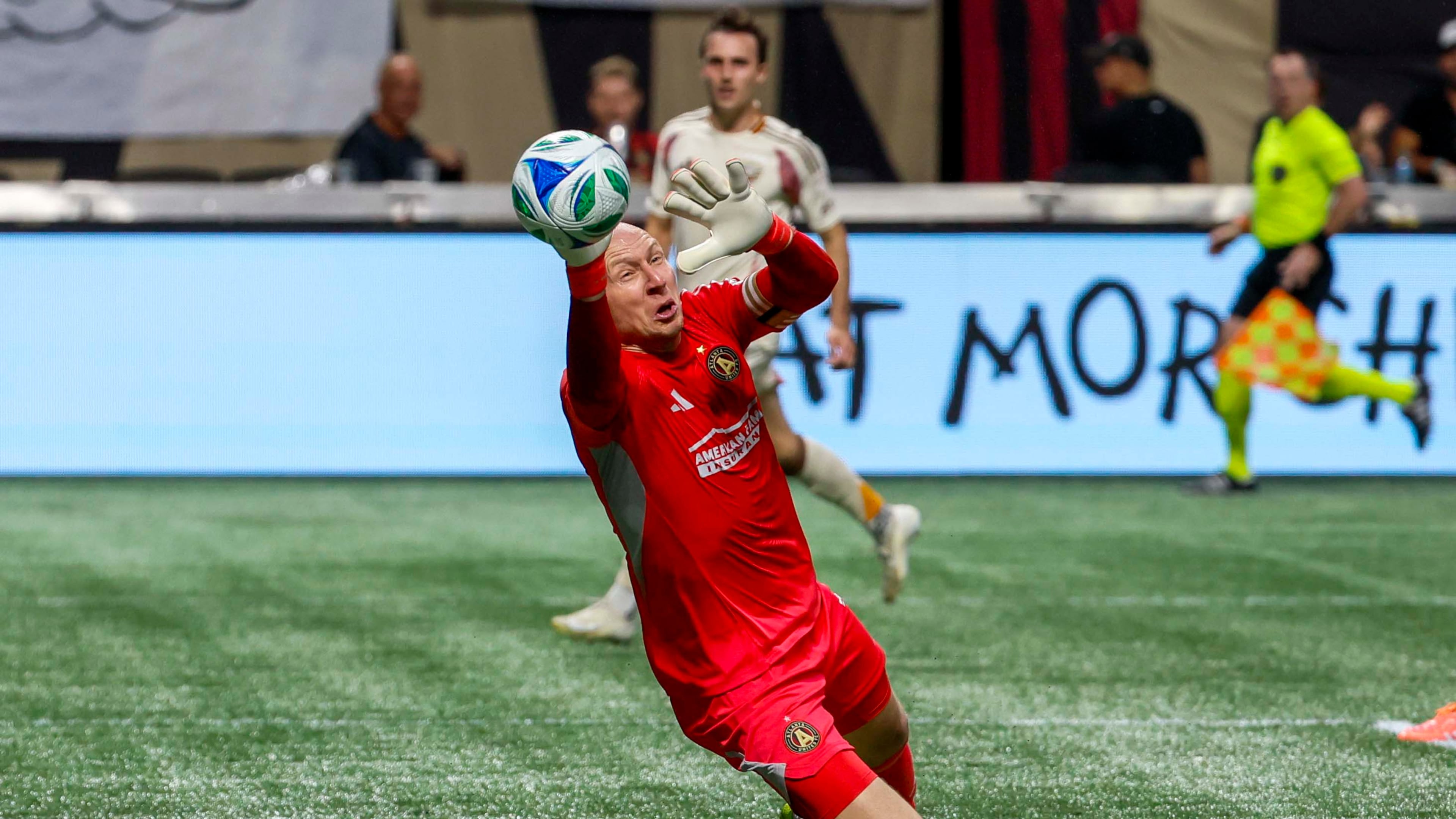 Atlanta United goalkeeper Brad Guzan (1) dives for a save against DC United during the first half of a soccer match in Atlanta, Saturday, Oct. 18, 2025. (Miguel Martinez/AJC)