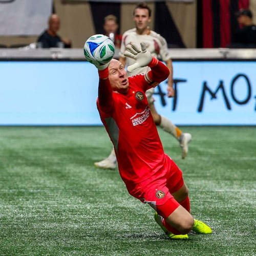 Atlanta United goalkeeper Brad Guzan (1) dives for a save against DC United during the first half of a soccer match in Atlanta, Saturday, Oct. 18, 2025. (Miguel Martinez/AJC)