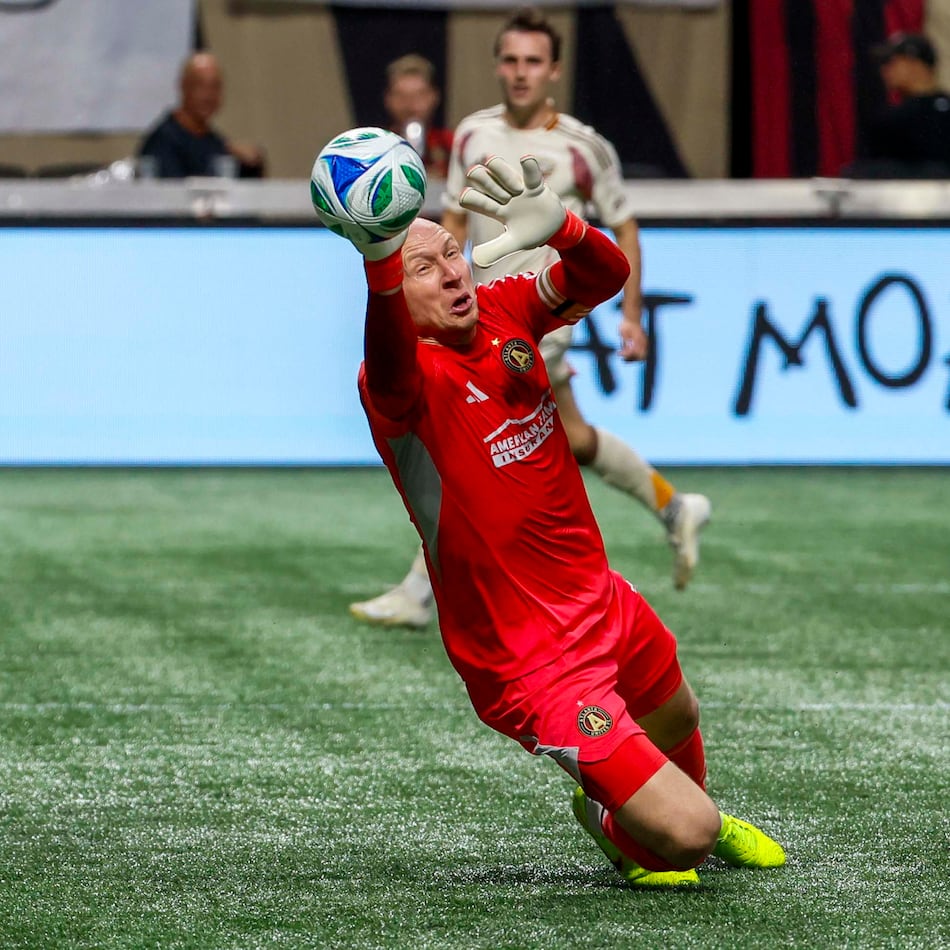 Atlanta United goalkeeper Brad Guzan (1) dives for a save against DC United during the first half of a soccer match in Atlanta, Saturday, Oct. 18, 2025. (Miguel Martinez/AJC)