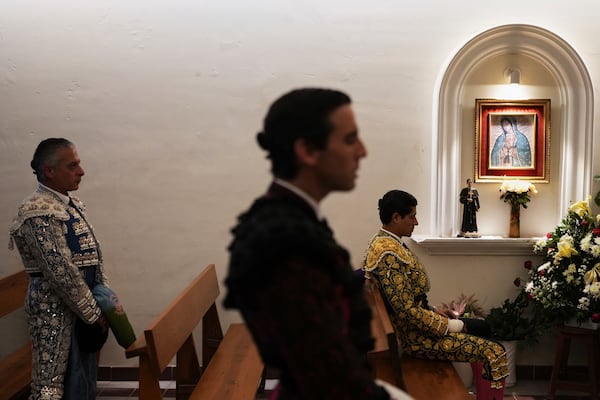 Bullfighters pray in the bullring chapel before a bullfight in Aguascalientes, Mexico, Saturday, April 26, 2025. (AP Photo/Eduardo Verdugo)
