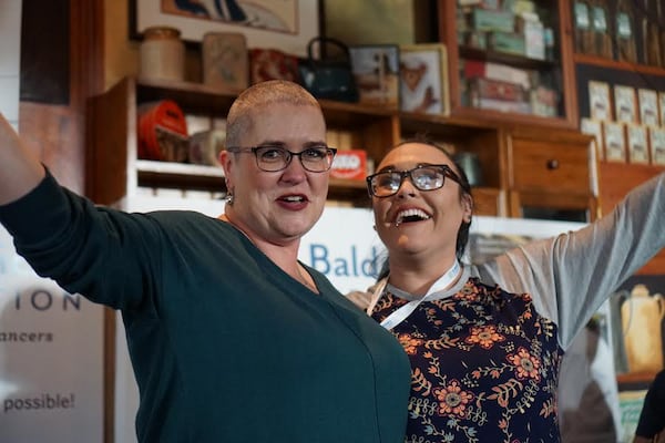 Tammy Kelley, clinical operations manager at CHOA’s Aflac cancer center, said she decided to get her head shaved this year, only a few months after the death of her husband. Here she is with her daughter Marlana Mayhue.