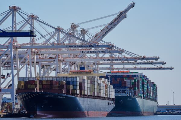Container ships Epaminondas and Talos are docked at the Port of Baltimore, Wednesday, April 9, 2025, in Baltimore. (AP Photo/Stephanie Scarbrough)